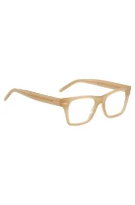 Montura para gafas graduadas de acetato beige con detalle dorado de la marca