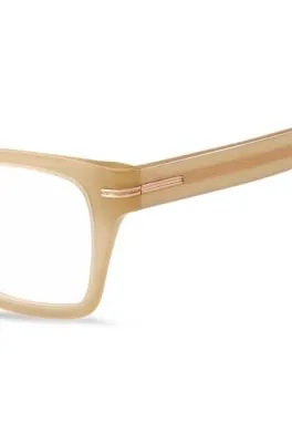 Montura para gafas graduadas de acetato beige con detalle dorado de la marca